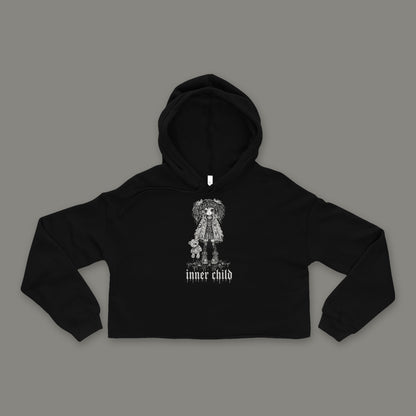 Inner Child Cropped Hoodie by Trauma Dump, black goth cropped hoodie front with girl and teddy bear print, mockup view 2