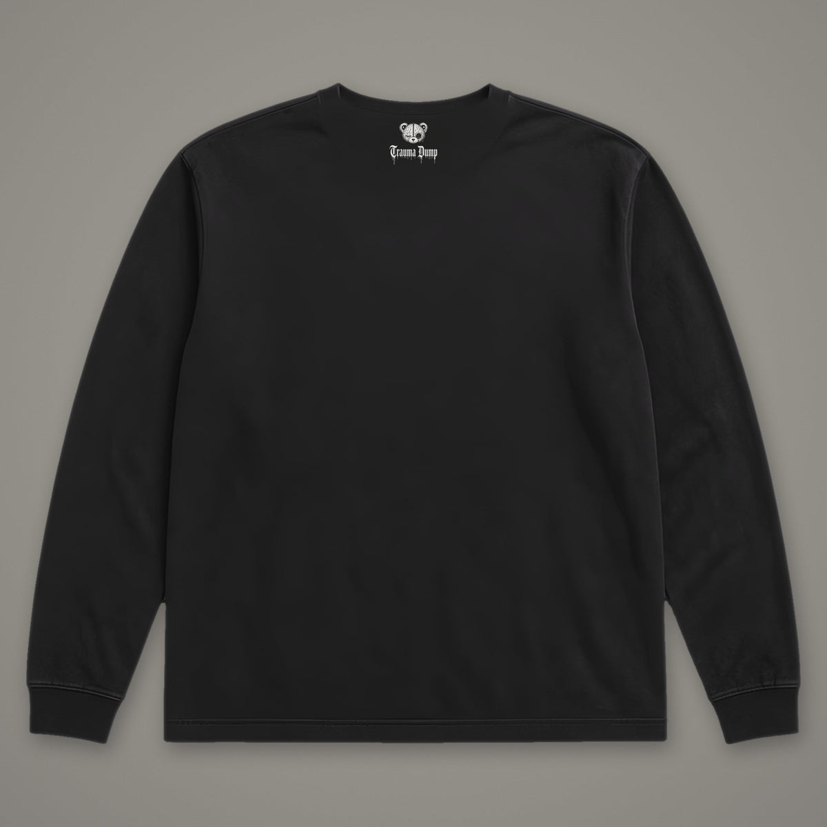 Inner Child Long Sleeve Tee in black, back view with Trauma Dump bear-head logo under the collar