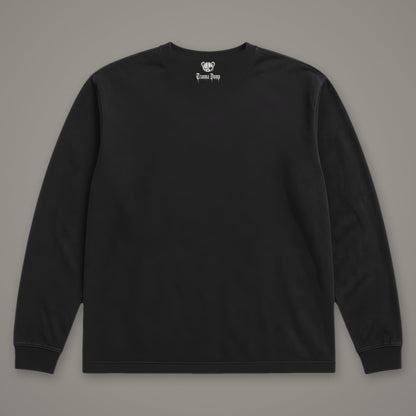 Inner Child Long Sleeve Tee in black, back view with Trauma Dump bear-head logo under the collar