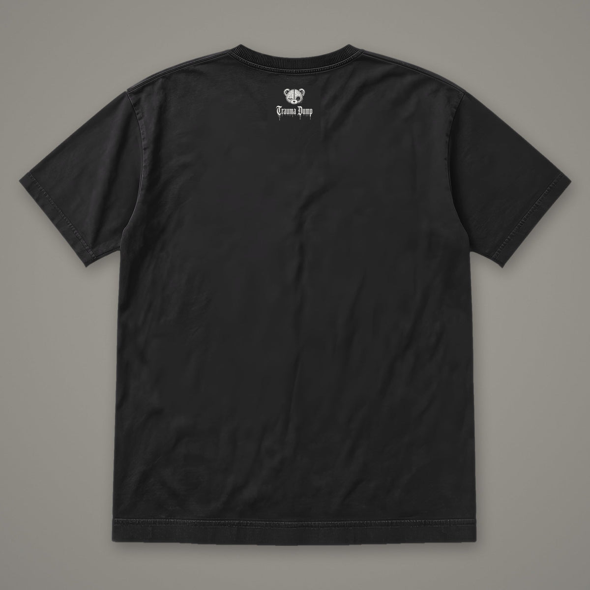 Inner Child Men's Heavyweight Tee by Trauma Dump, men's heavyweight tee back view with Trauma Dump bear-head logo under the collar (Black, white ink)