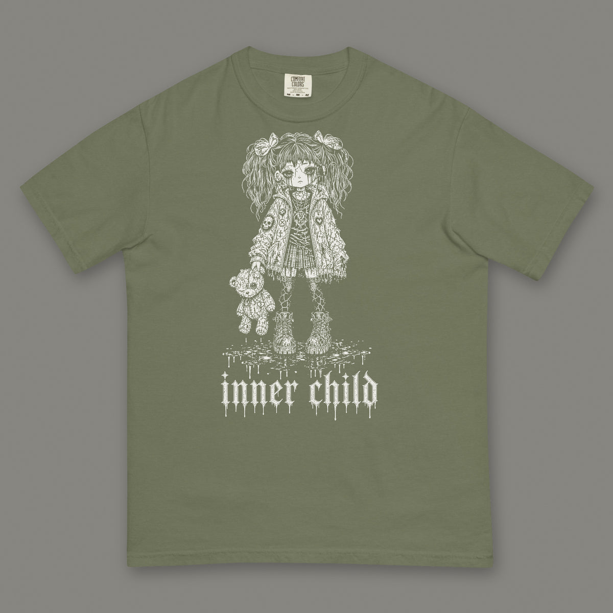 Inner Child Men's Heavyweight Tee in moss by Trauma Dump, little girl with teddy bear tattoo-style gothic graphic in white ink (Moss, white ink)