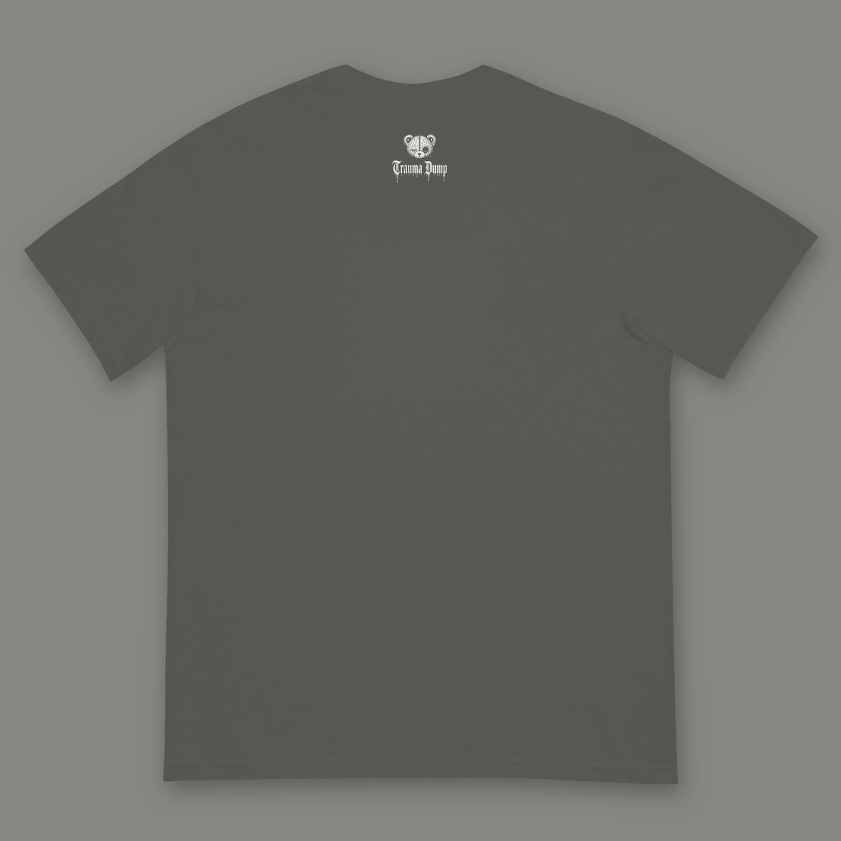 Inner Child Men's Heavyweight Tee back, Trauma Dump bear-head logo under the collar (Pepper, white ink)