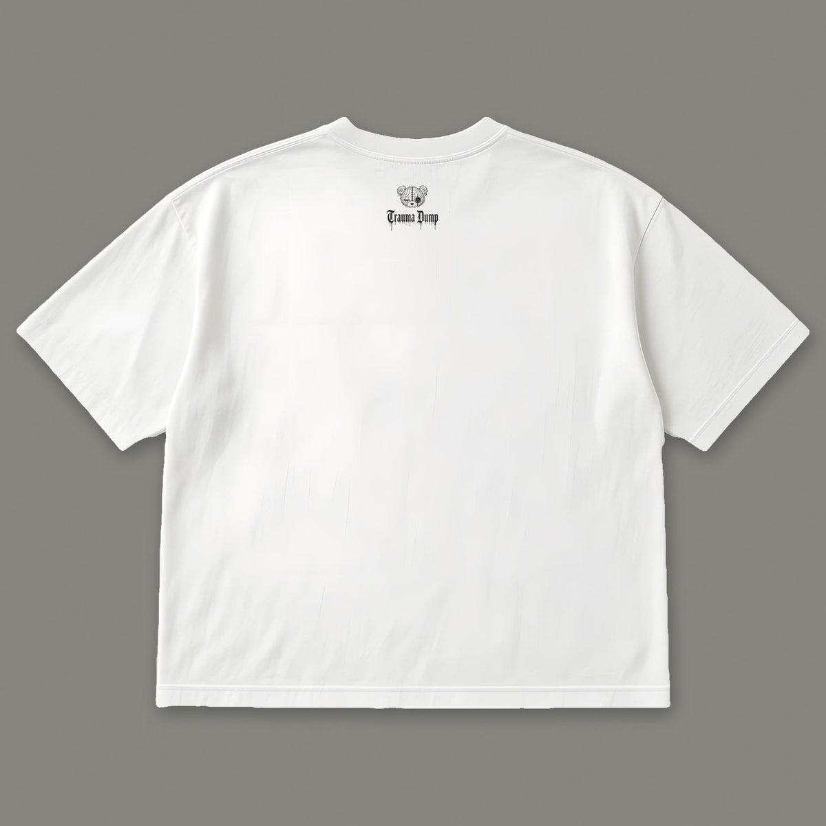 Inner Child Women's Boxy Tee - White by Trauma Dump, women's boxy goth tee back view with black Trauma Dump bear-head logo under the collar