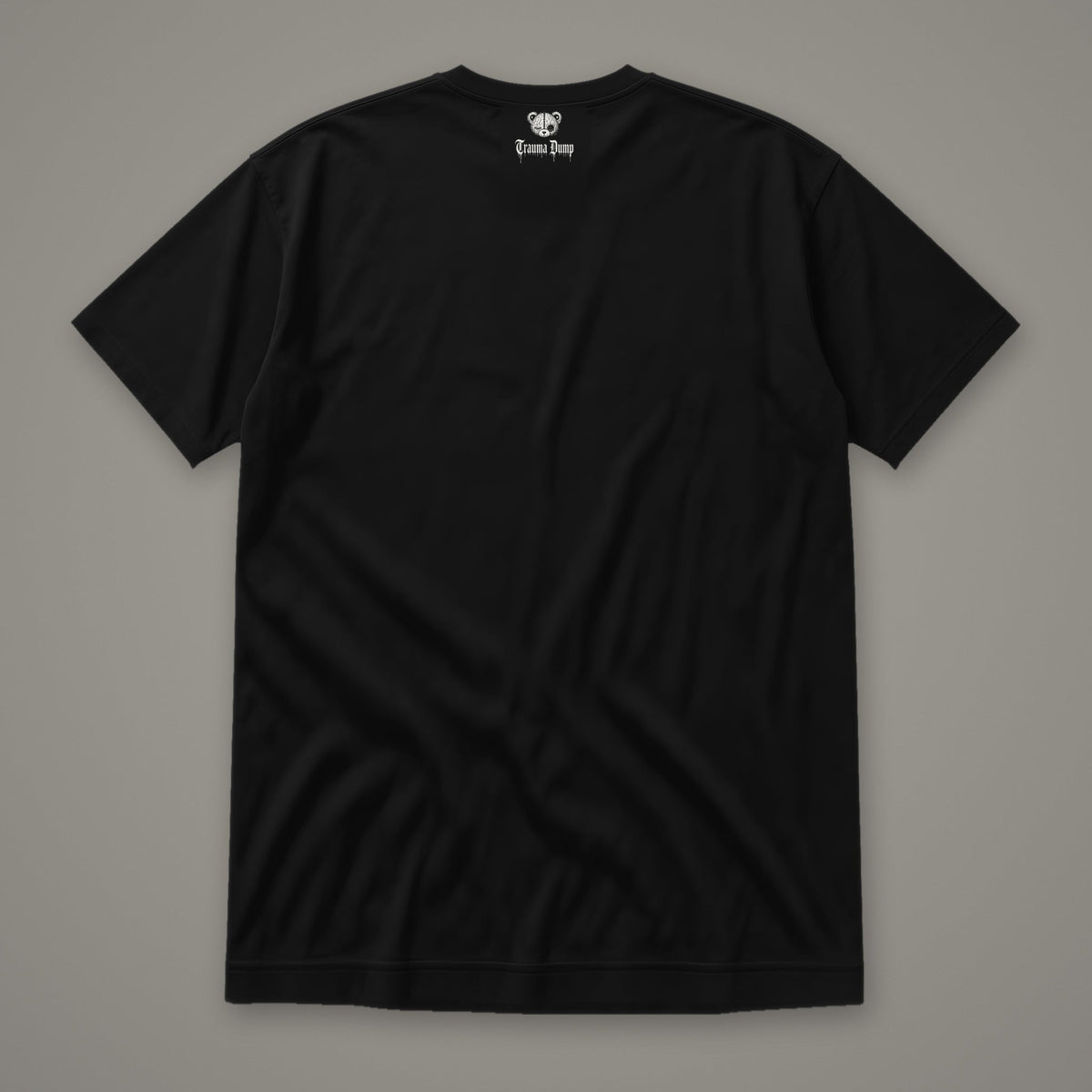 Inner Child Women's Relaxed Tee by Trauma Dump, women's relaxed tee back view with Trauma Dump bear-head logo under the collar (Black, white ink)