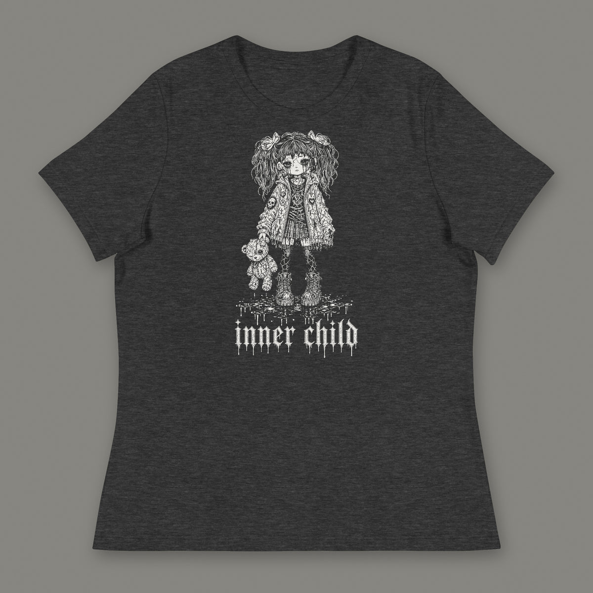 Inner Child Women's Relaxed Tee in dark grey heather by Trauma Dump, little girl with teddy bear tattoo-style gothic graphic in white ink (Dark Grey Heather, white ink)