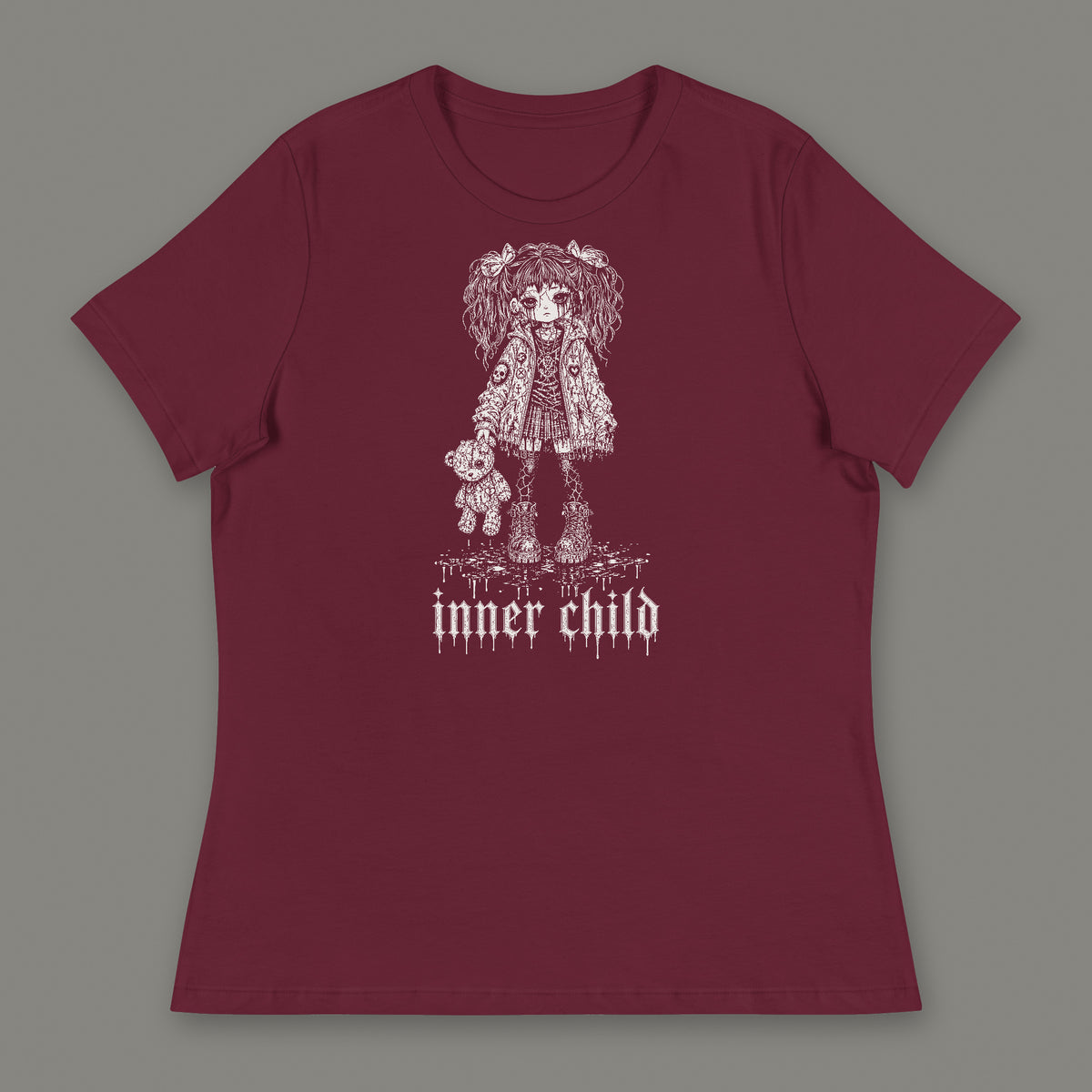 Inner Child Women's Relaxed Tee in maroon by Trauma Dump, little girl with teddy bear tattoo-style gothic graphic in white ink (Maroon, white ink)