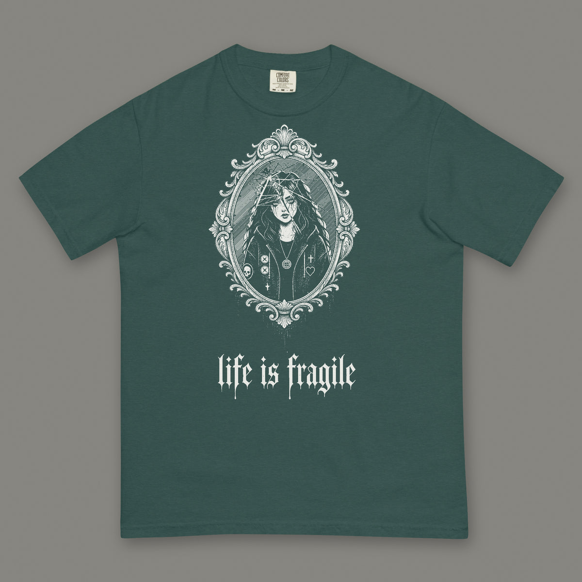 Life is Fragile Men's Heavyweight Tee in blue spruce by Trauma Dump, cracked mirror tattoo-style gothic graphic in white ink (Blue Spruce, white ink)