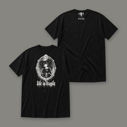 Life is Fragile Women's Relaxed Tee in black by Trauma Dump, white-ink print of young Wren in a cracked oval mirror frame with dripping "life is fragile" lettering, front and back view (Black, white ink)