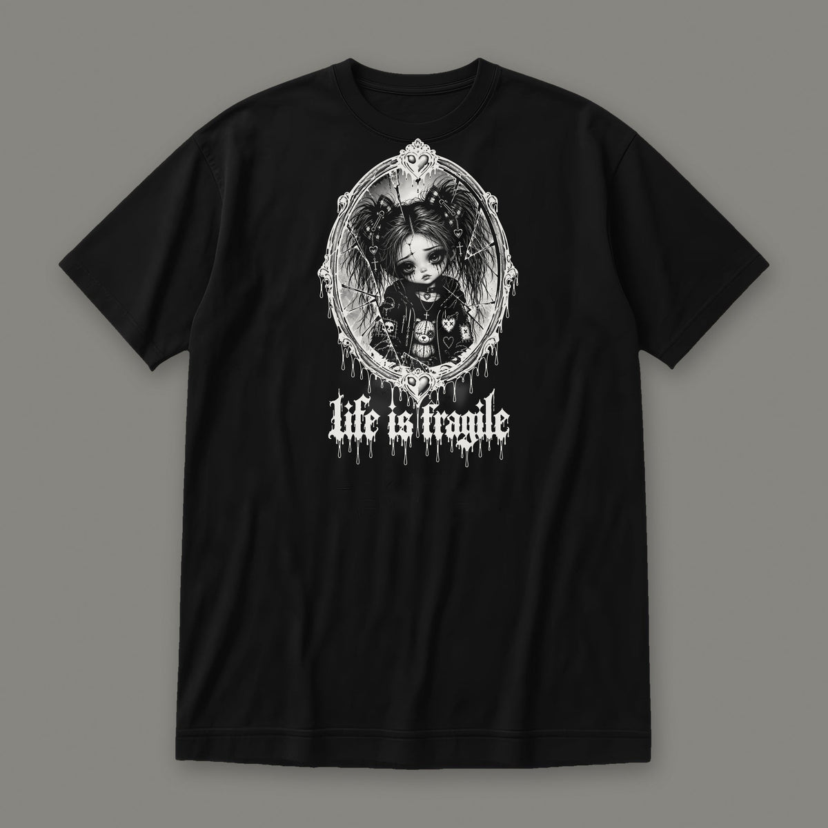 Life is Fragile Women's Relaxed Tee in black by Trauma Dump, white-ink print of young Wren in a cracked oval mirror frame with dripping "life is fragile" lettering (Black, white ink)