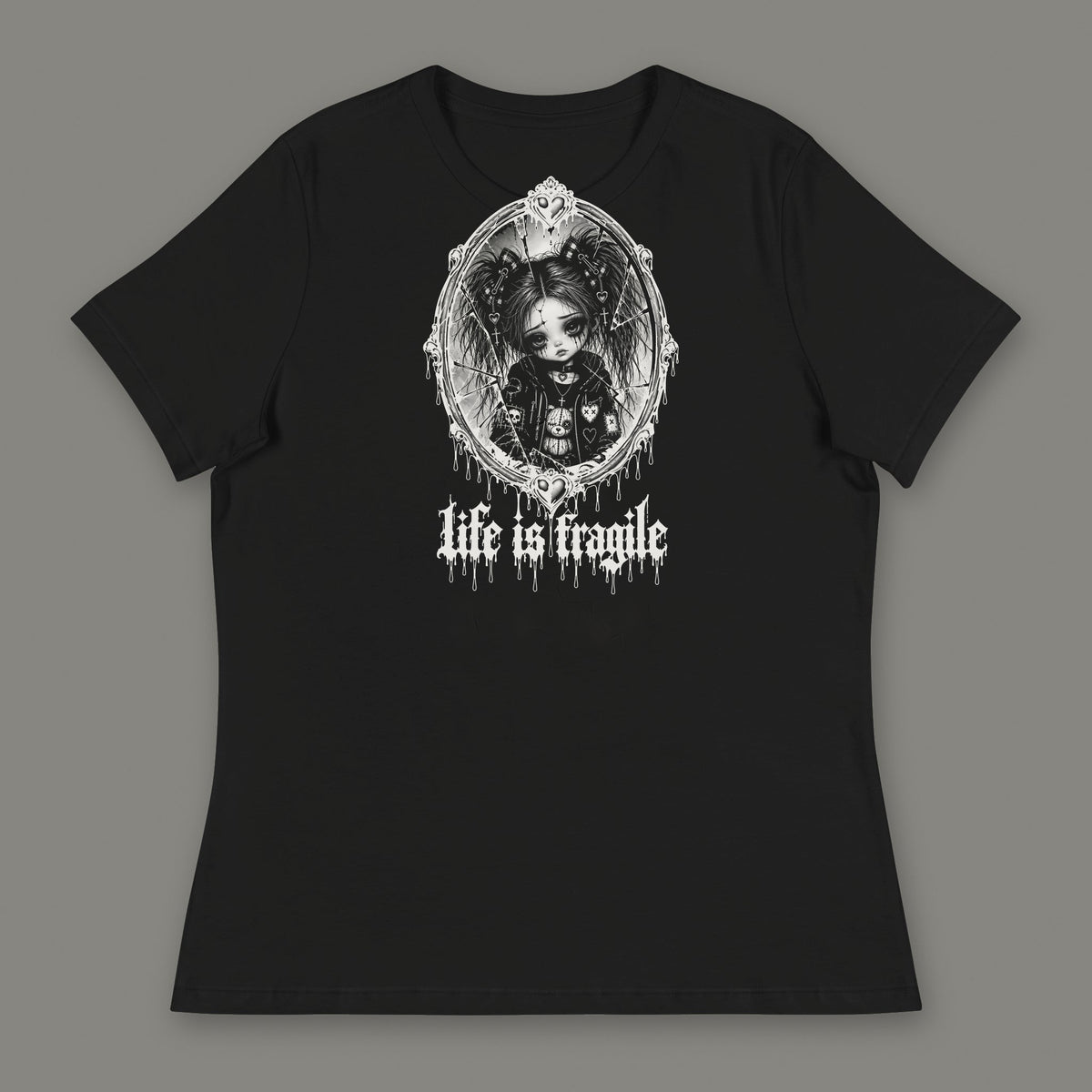 Life is Fragile Women's Relaxed Tee in black by Trauma Dump, white-ink print of young Wren in a cracked oval mirror frame with dripping "life is fragile" lettering (Black, white ink)