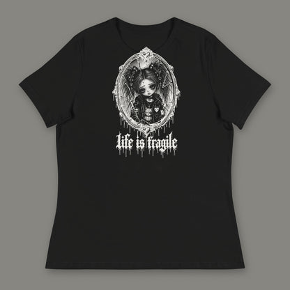 Life is Fragile Women's Relaxed Tee in black by Trauma Dump, white-ink print of young Wren in a cracked oval mirror frame with dripping "life is fragile" lettering (Black, white ink)