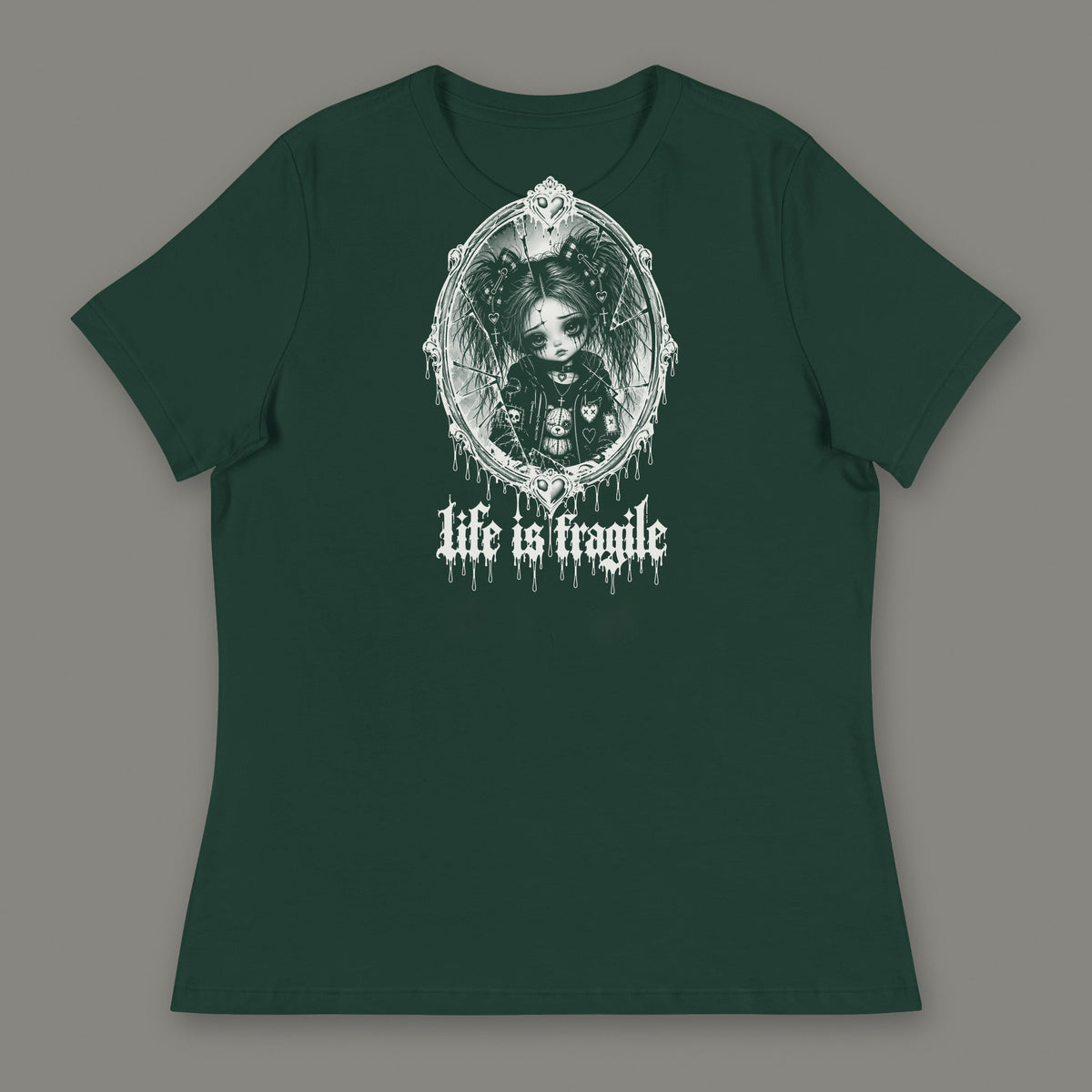Life is Fragile Women's Relaxed Tee in forest green by Trauma Dump, white-ink print of young Wren in a cracked oval mirror frame with dripping "life is fragile" lettering (Forest Green, white ink)