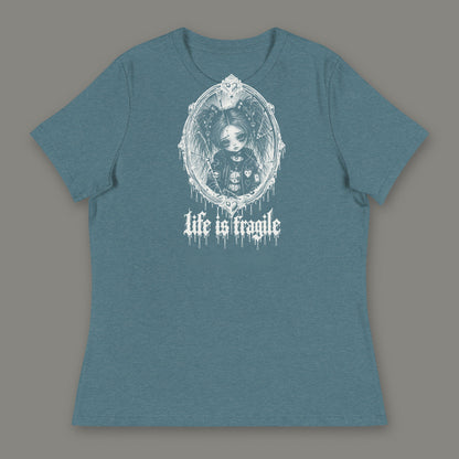 Life is Fragile Women's Relaxed Tee in heather deep teal by Trauma Dump, white-ink print of young Wren in a cracked oval mirror frame with dripping "life is fragile" lettering (Heather Deep Teal, white ink)