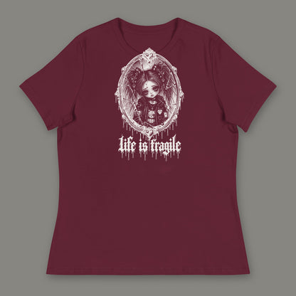 Life is Fragile Women's Relaxed Tee in maroon by Trauma Dump, white-ink print of young Wren in a cracked oval mirror frame with dripping "life is fragile" lettering (Maroon, white ink)