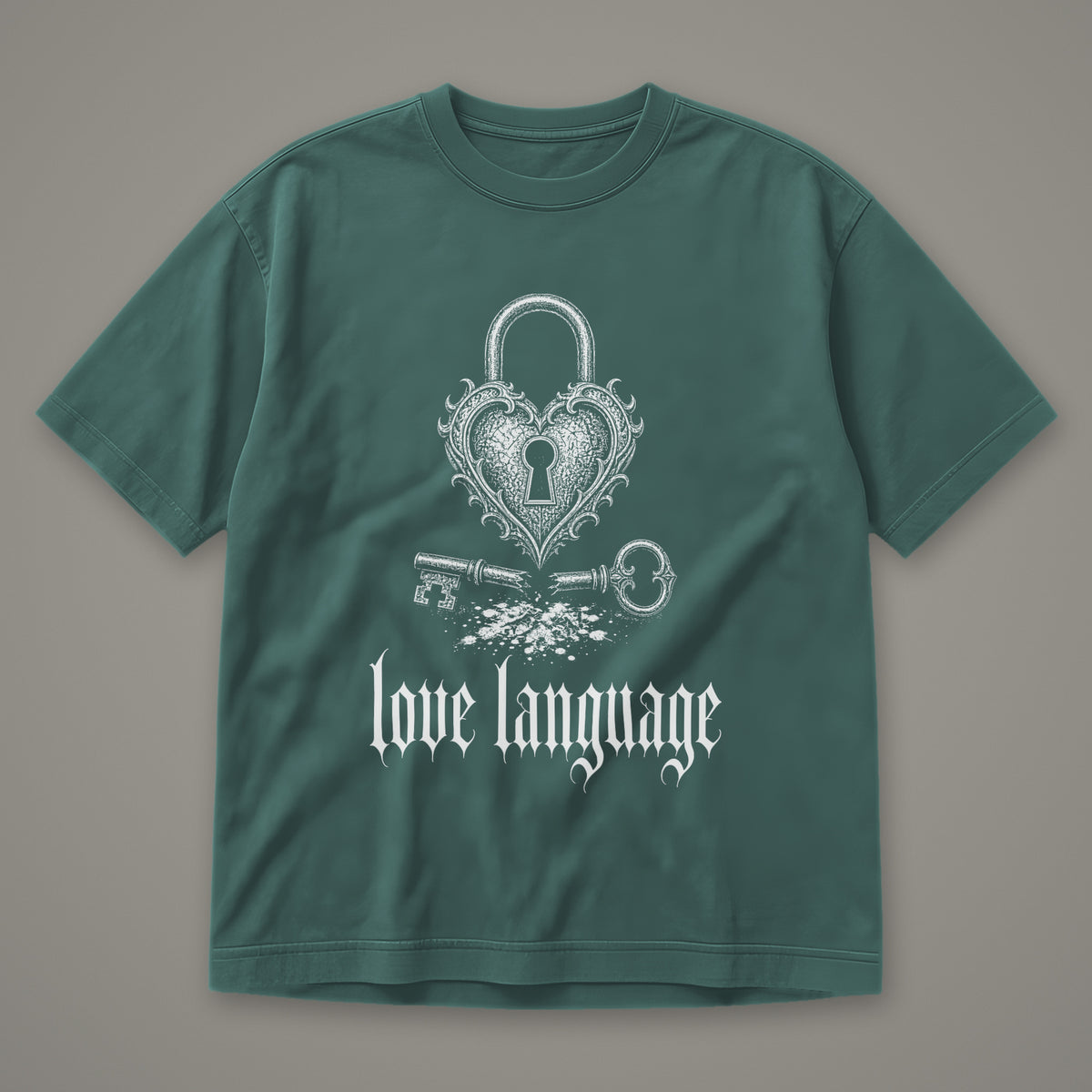 Love Language Men's Heavyweight Tee in blue spruce by Trauma Dump, heart padlock and broken key tattoo-style gothic graphic in white ink (Blue Spruce, white ink)