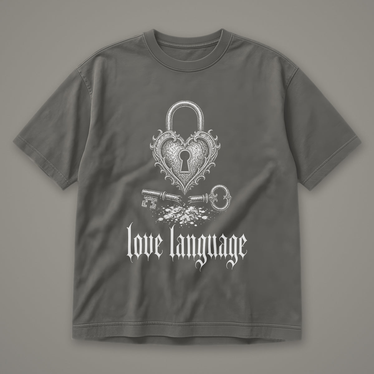Love Language Men's Heavyweight Tee in pepper by Trauma Dump, heart padlock and broken key tattoo-style gothic graphic in white ink (Pepper, white ink)