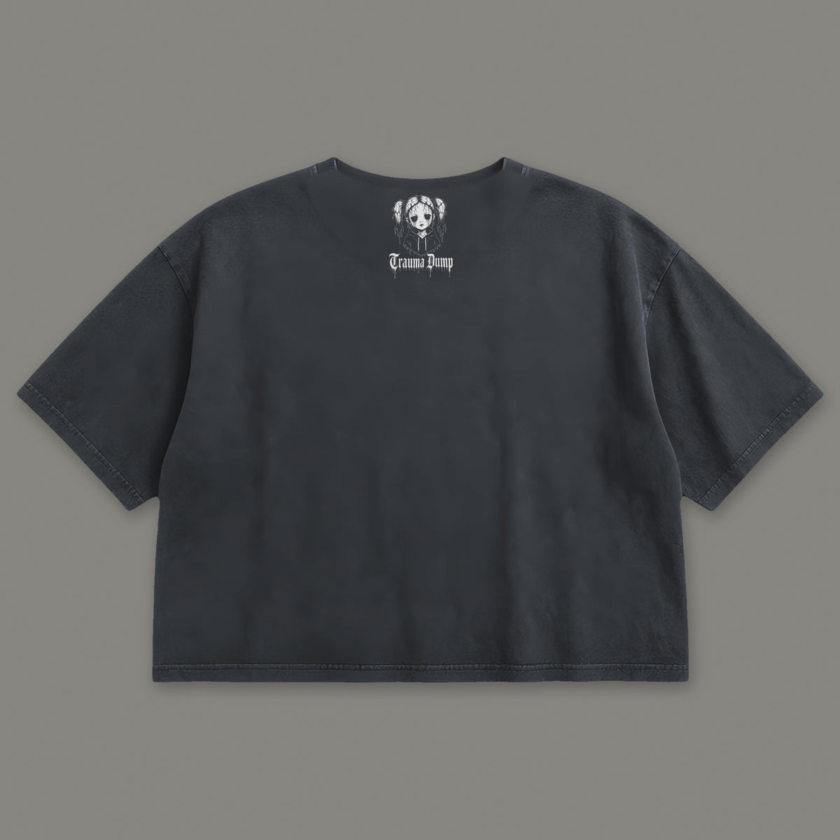 People Pleaser Cropped Baby Tee in black, back view with doll portrait logo under the collar