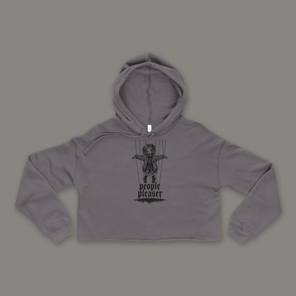 People Pleaser Cropped Hoodie in storm by Trauma Dump, storm grey goth cropped hoodie front with cut-strings marionette print in black ink (Storm, black ink)