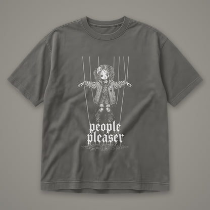 People Pleaser Men's Heavyweight Tee in pepper by Trauma Dump, cut-string marionette tattoo-style gothic graphic in white ink (Pepper, white ink)