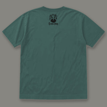 People Pleaser Men's Heavyweight Tee in blue spruce by Trauma Dump, men's heavyweight tee goth tee back view with TD doll logo under the collar in black ink (Blue Spruce, black ink)
