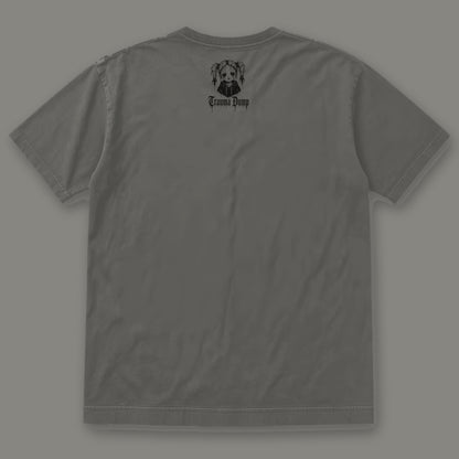 People Pleaser Men's Heavyweight Tee in pepper by Trauma Dump, men's heavyweight tee goth tee back view with TD doll logo under the collar in black ink (Pepper, black ink)