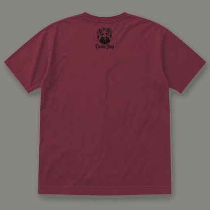 People Pleaser Men's Heavyweight Tee in wine by Trauma Dump, men's heavyweight tee goth tee back view with TD doll logo under the collar in black ink (Wine, black ink)