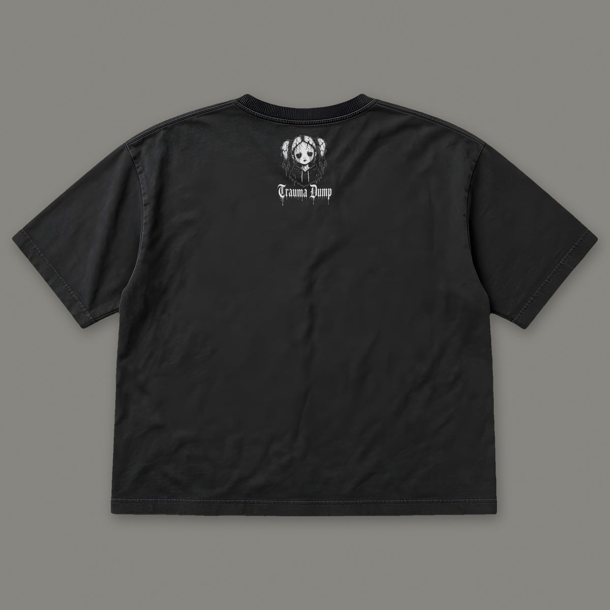 People Pleaser Women's Boxy Tee by Trauma Dump, women's boxy goth tee back view with TD doll logo under the collar (Black, white ink)