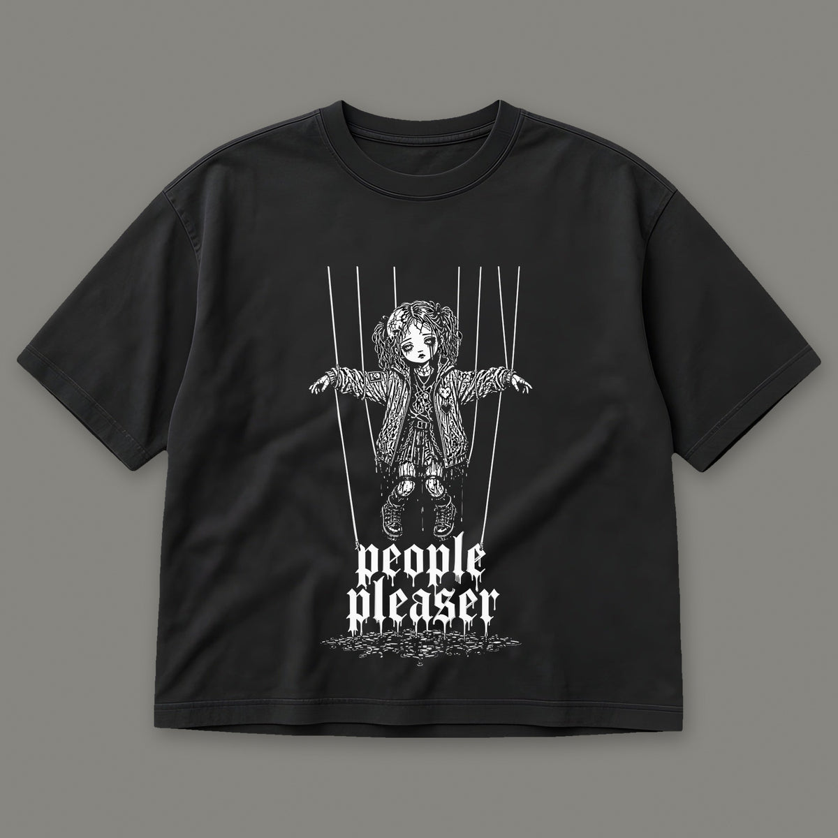 People Pleaser Women's Boxy Tee in black by Trauma Dump, cut-string marionette tattoo-style gothic graphic (Black, white ink)