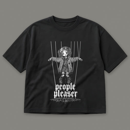 People Pleaser Women's Boxy Tee in black by Trauma Dump, cut-string marionette tattoo-style gothic graphic (Black, white ink)