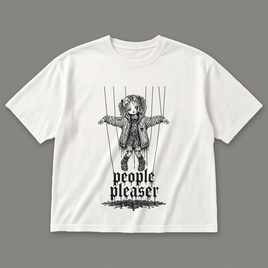 People Pleaser Women's Boxy Tee in white by Trauma Dump, cut-string marionette tattoo-style gothic graphic in black ink