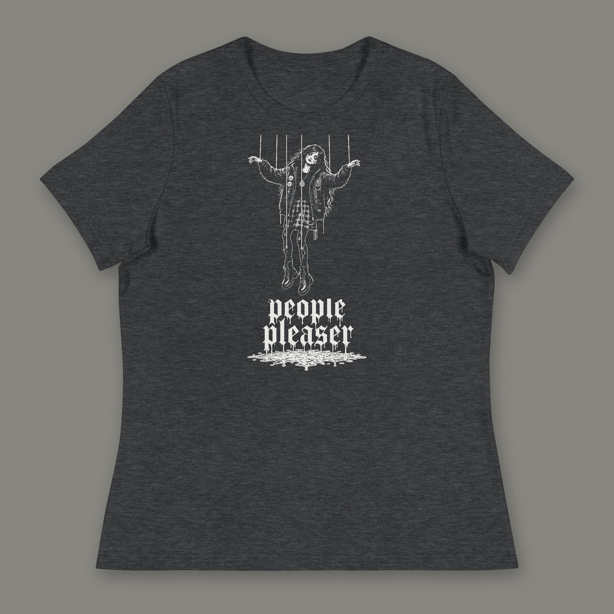 People Pleaser Women's Relaxed Tee in dark grey heather by Trauma Dump, cut-string marionette tattoo-style gothic graphic in white ink (Dark Grey Heather, white ink)