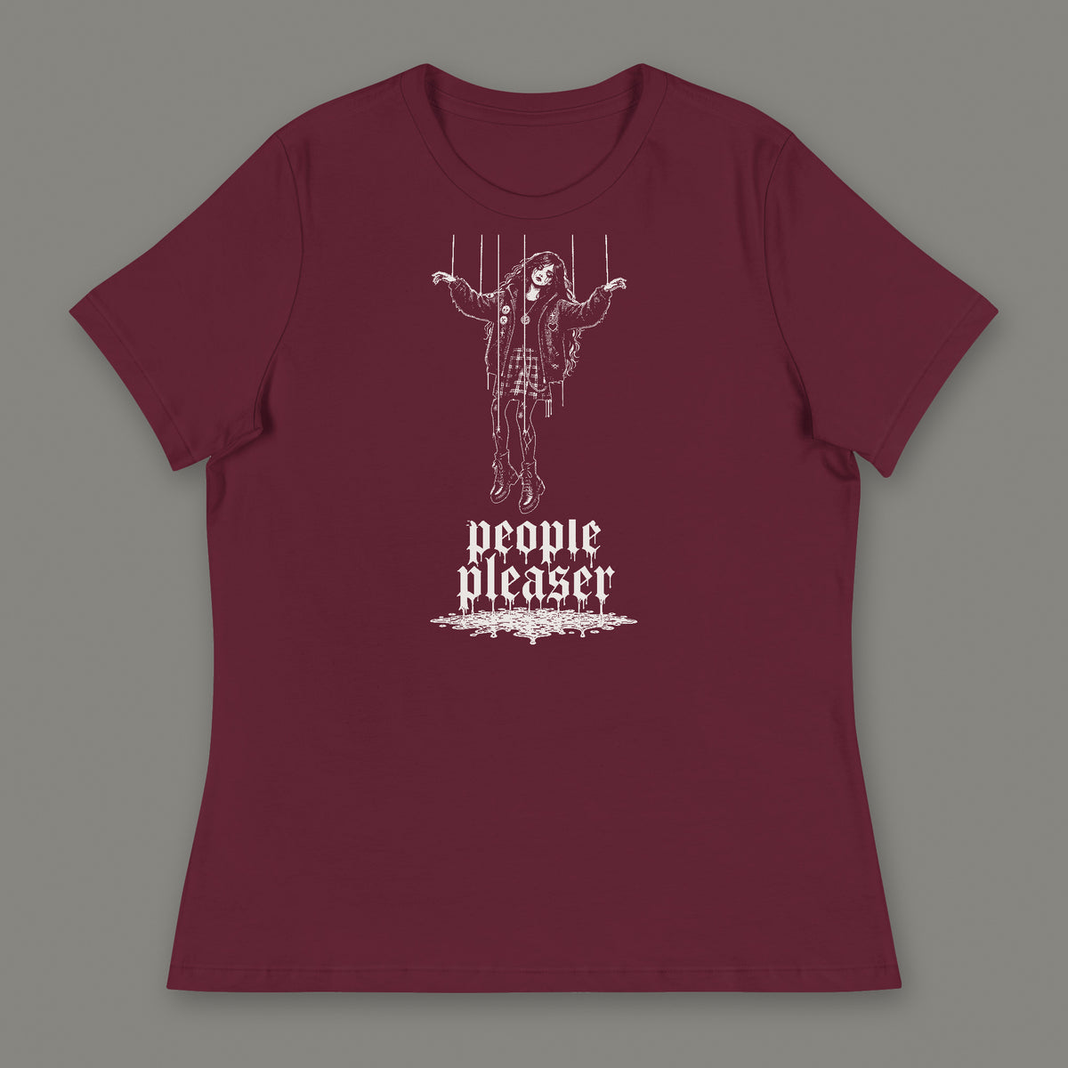 People Pleaser Women's Relaxed Tee in maroon by Trauma Dump, cut-string marionette tattoo-style gothic graphic in white ink (Maroon, white ink)