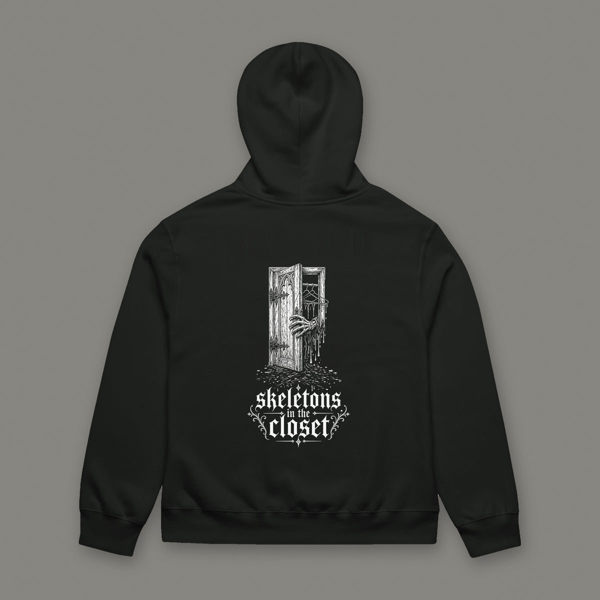 Skeletons in the Closet Oversized Heavyweight Hoodie by Trauma Dump, oversized goth hoodie with skeleton hand print, mockup view 7 (Vintage Black, white ink)