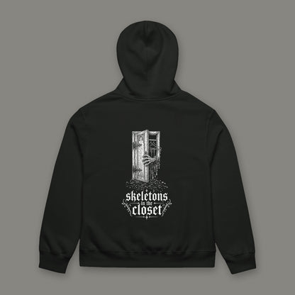 Skeletons in the Closet Oversized Heavyweight Hoodie by Trauma Dump, oversized goth hoodie with skeleton hand print, mockup view 7 (Vintage Black, white ink)