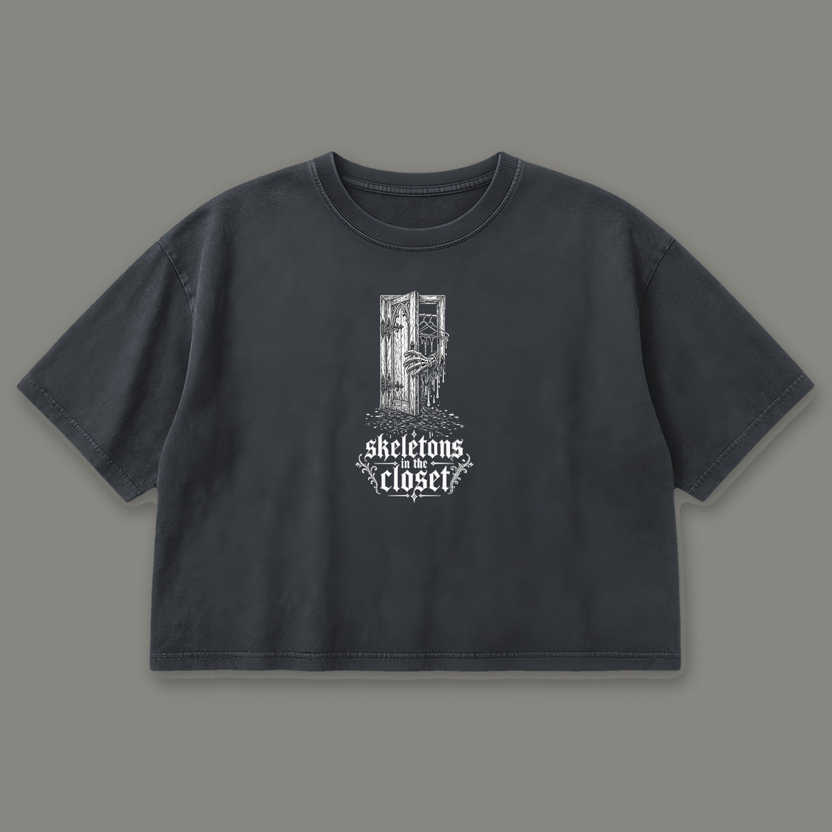 Skeletons in the Closet Cropped Baby Tee in black, front view