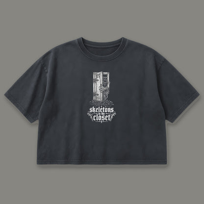 Skeletons in the Closet Cropped Baby Tee in black, front view