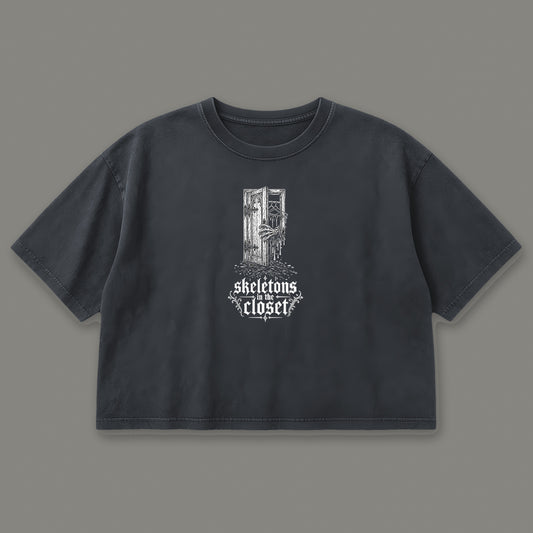 Skeletons in the Closet Cropped Baby Tee in black, front view