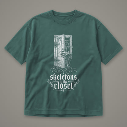 Skeletons in the Closet Men's Heavyweight Tee in blue spruce by Trauma Dump, skeleton hand in a closet door tattoo-style gothic graphic in white ink (Blue Spruce, white ink)