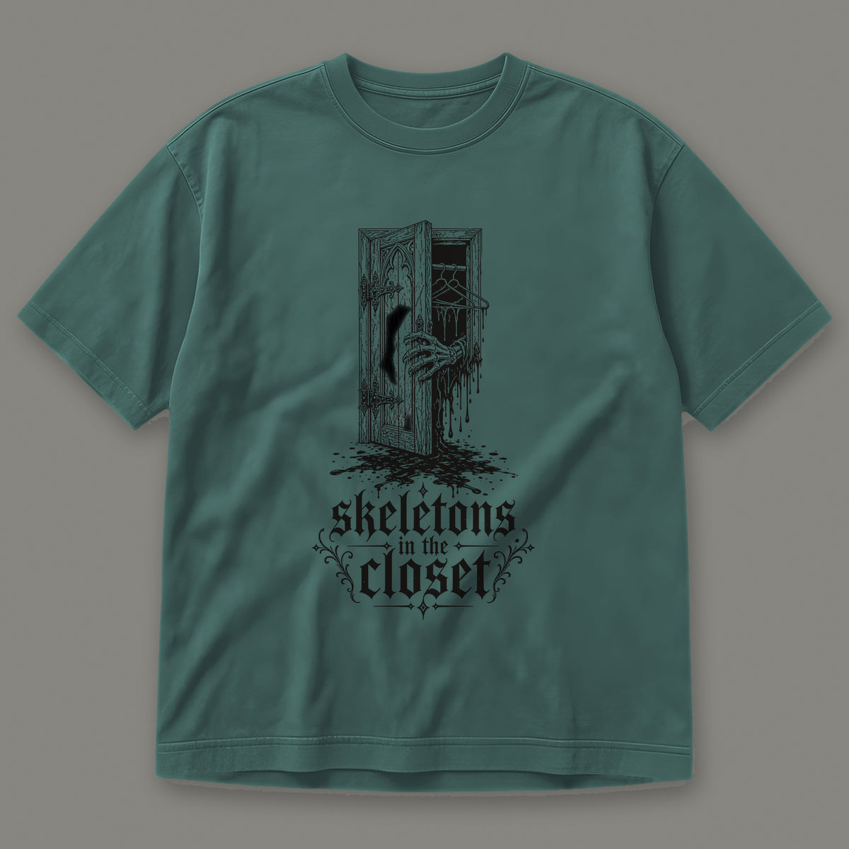 Skeletons in the Closet Men's Heavyweight Tee in blue spruce by Trauma Dump, skeleton hand in a closet door tattoo-style gothic graphic in black ink (Blue Spruce, black ink)