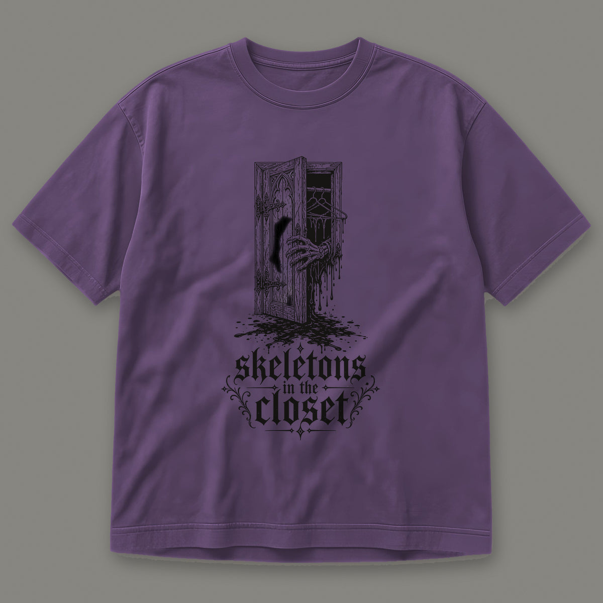 Skeletons in the Closet Men's Heavyweight Tee in grape by Trauma Dump, skeleton hand in a closet door tattoo-style gothic graphic in black ink (Grape, black ink)