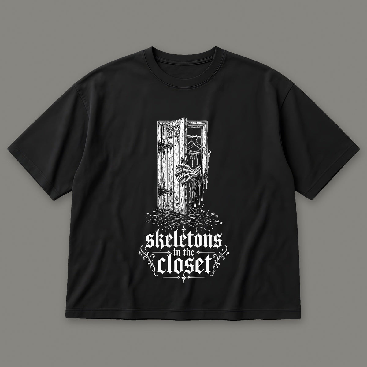 Skeletons in the Closet Men's Oversized Tee in black by Trauma Dump, skeleton hand in a closet door tattoo-style gothic graphic