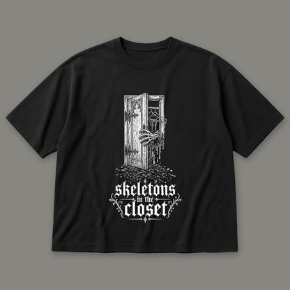 Skeletons in the Closet Men's Oversized Tee in black by Trauma Dump, skeleton hand in a closet door tattoo-style gothic graphic