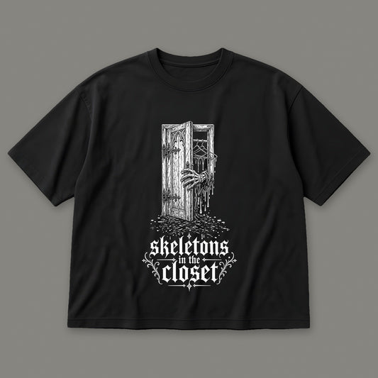 Skeletons in the Closet Men's Oversized Tee in black by Trauma Dump, skeleton hand in a closet door tattoo-style gothic graphic