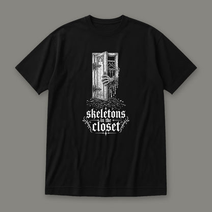 Skeletons in the Closet Women's Relaxed Tee in black by Trauma Dump, skeleton hand in a closet door tattoo-style gothic graphic in white ink (Black, white ink)