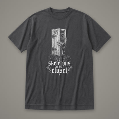 Skeletons in the Closet Women's Relaxed Tee in dark grey heather by Trauma Dump, skeleton hand in a closet door tattoo-style gothic graphic in white ink (Dark Grey Heather, white ink)