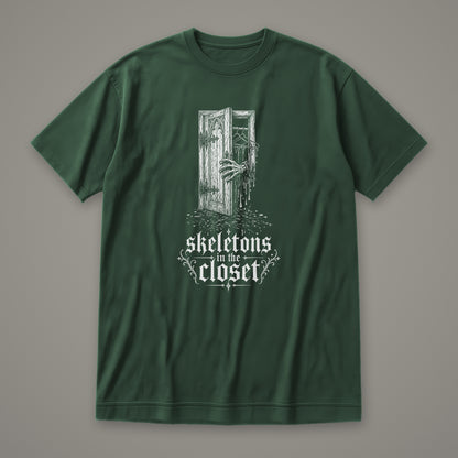 Skeletons in the Closet Women's Relaxed Tee in forest green by Trauma Dump, skeleton hand in a closet door tattoo-style gothic graphic in white ink (Forest Green, white ink)