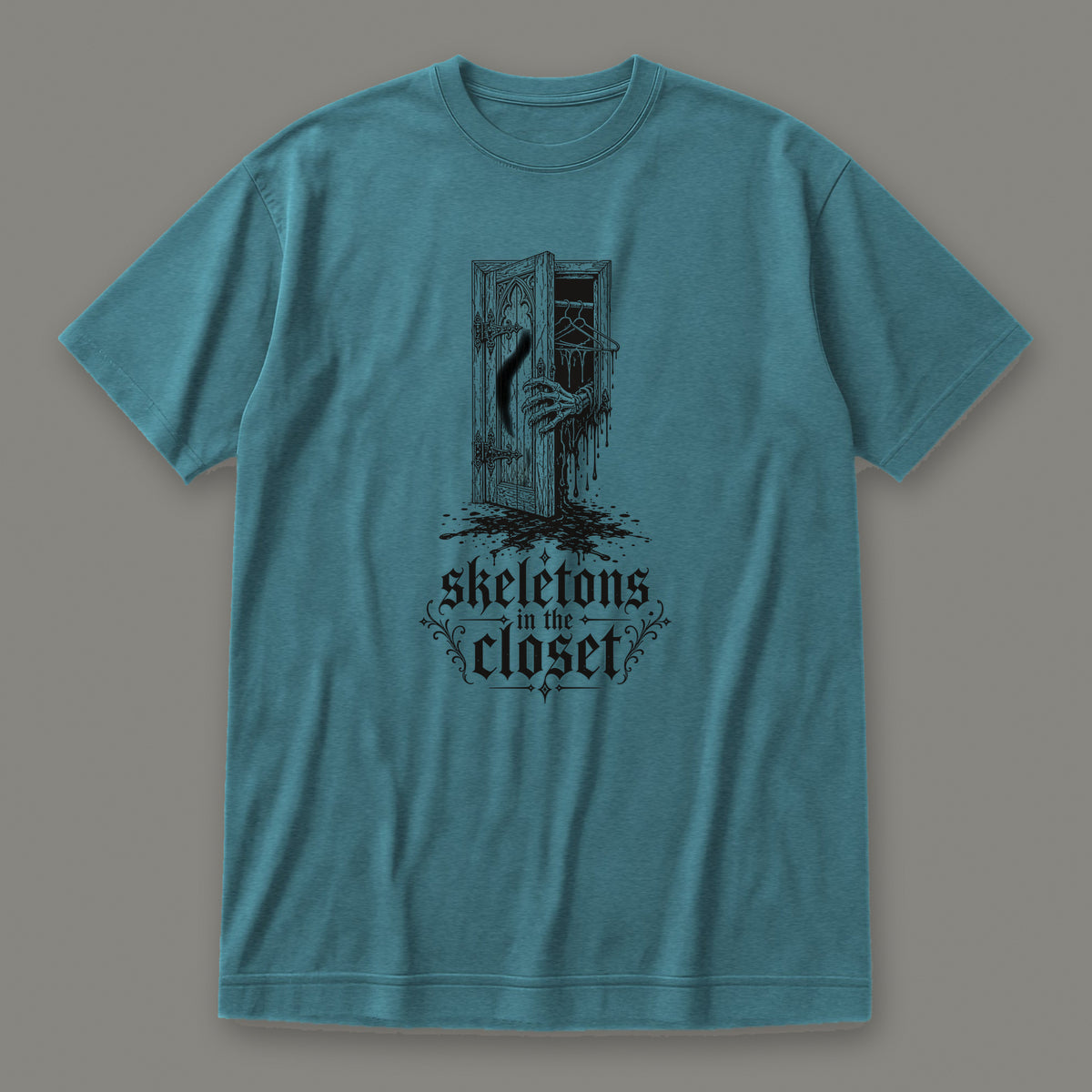 Skeletons in the Closet Women's Relaxed Tee in heather deep teal by Trauma Dump, skeleton hand in a closet door tattoo-style gothic graphic in black ink (Heather Deep Teal, black ink)