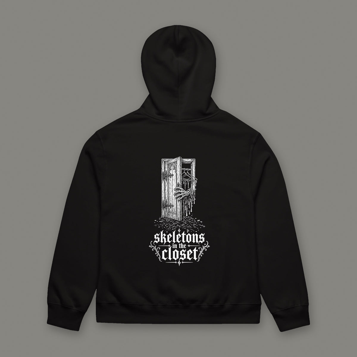 Skeletons in the Closet Oversized Heavyweight Hoodie by Trauma Dump, oversized goth hoodie with skeleton hand print, mockup view 5 (Black, white ink)