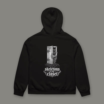 Skeletons in the Closet Oversized Heavyweight Hoodie by Trauma Dump, oversized goth hoodie with skeleton hand print, mockup view 5 (Black, white ink)