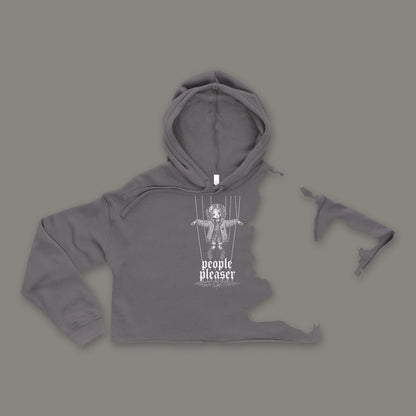 People Pleaser Cropped Hoodie by Trauma Dump, storm grey goth cropped hoodie front with cut-strings marionette print, mockup view 5 (Storm, white ink)